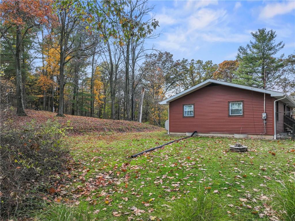 299 Ridge Road Darlington, PA 16115 - Photo 8 of 31 a view of a backyard with large trees