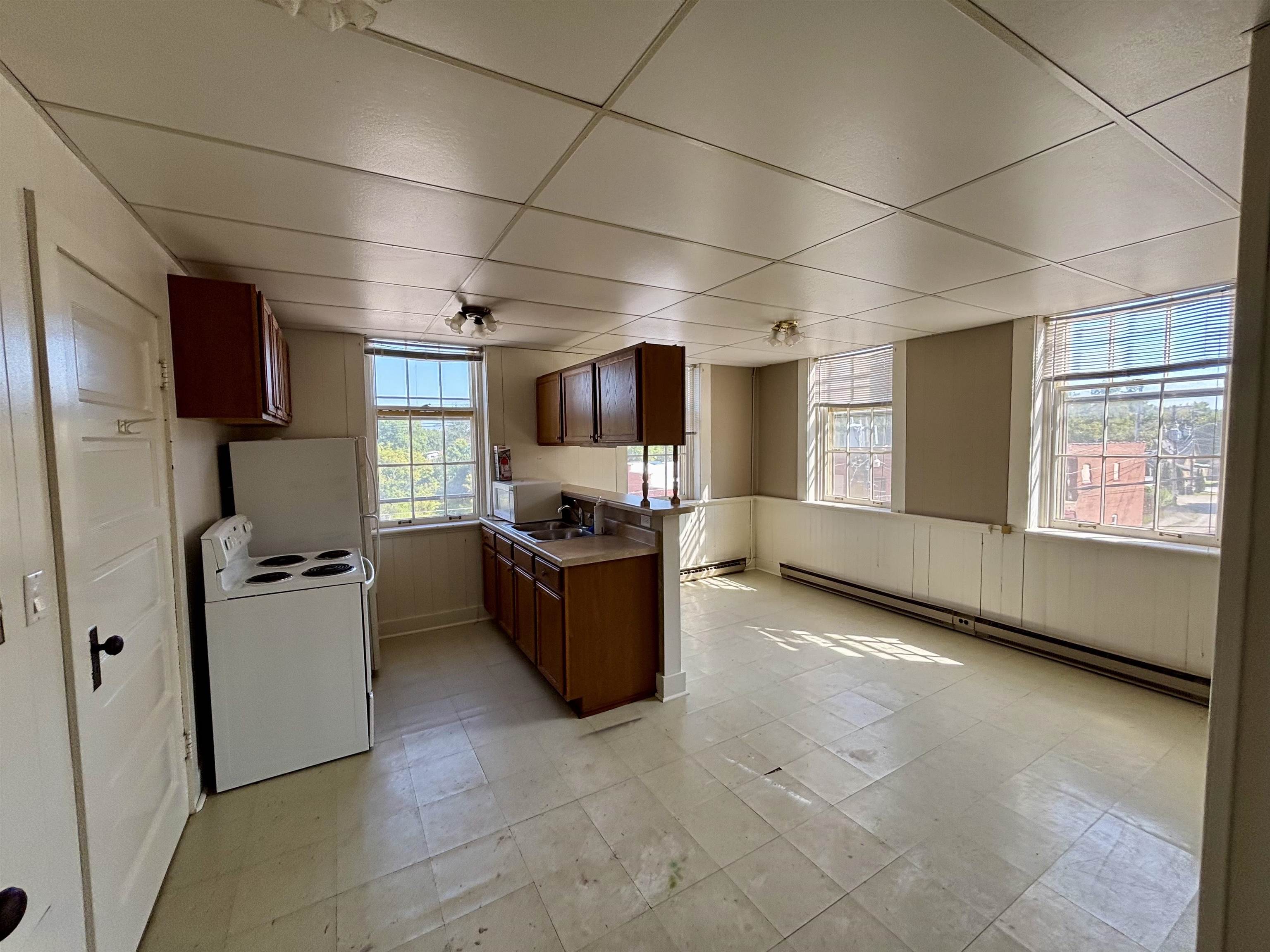 101 West Market Street Mount Carroll, IL 61053 - Photo 16 of 26 a kitchen with refrigerator and window