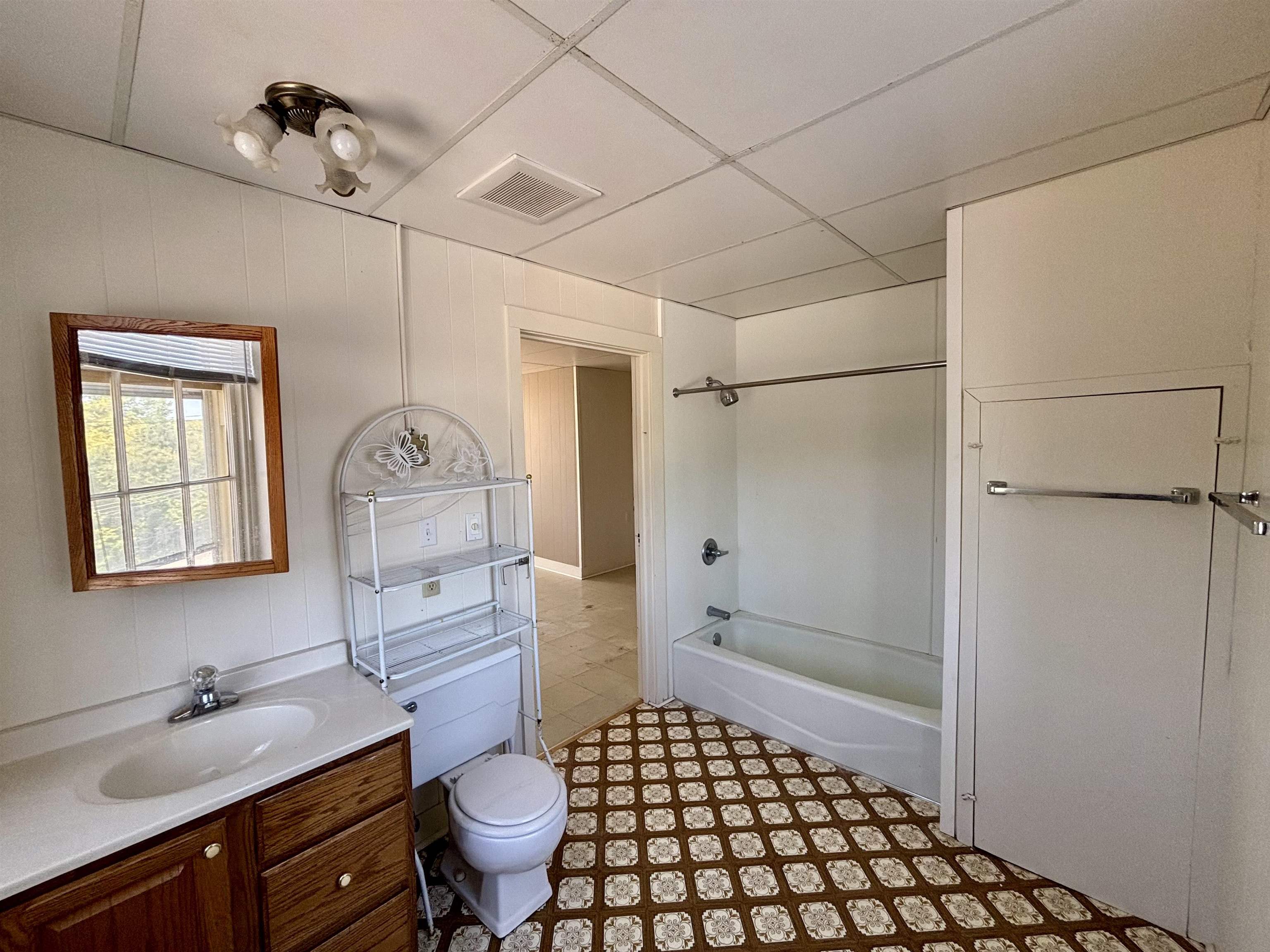 101 West Market Street Mount Carroll, IL 61053 - Photo 17 of 26 a bathroom with a sink toilet and shower