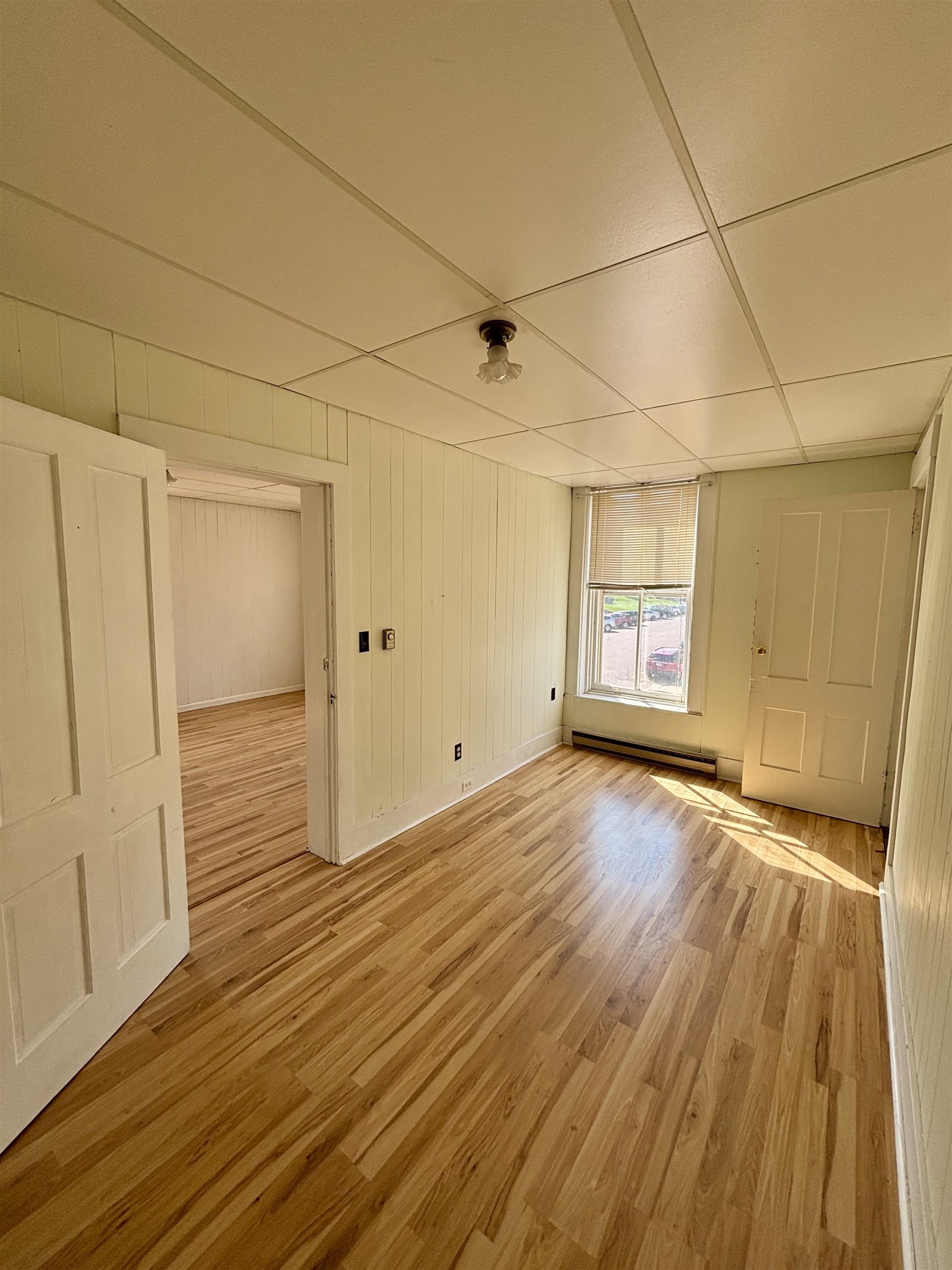 101 West Market Street Mount Carroll, IL 61053 - Photo 18 of 26 a view of a room with wooden floor