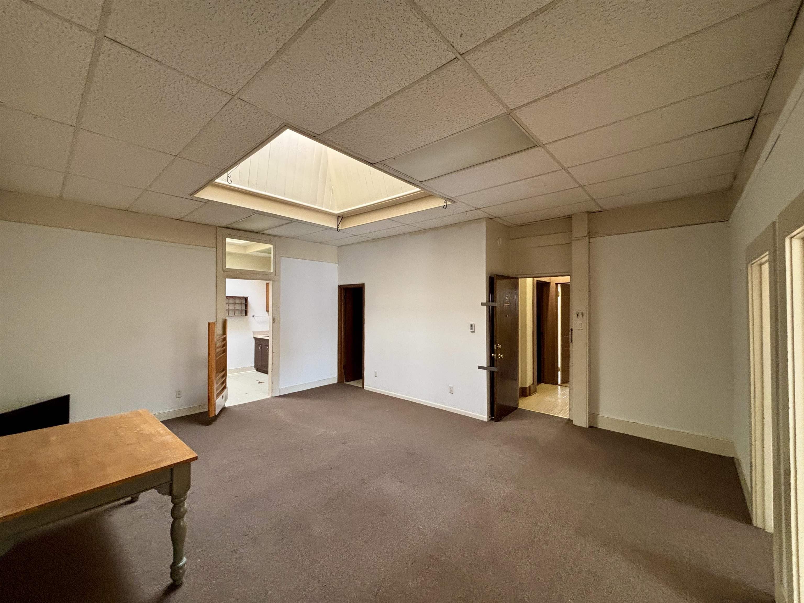 101 West Market Street Mount Carroll, IL 61053 - Photo 20 of 26 a view of empty room with wooden floor