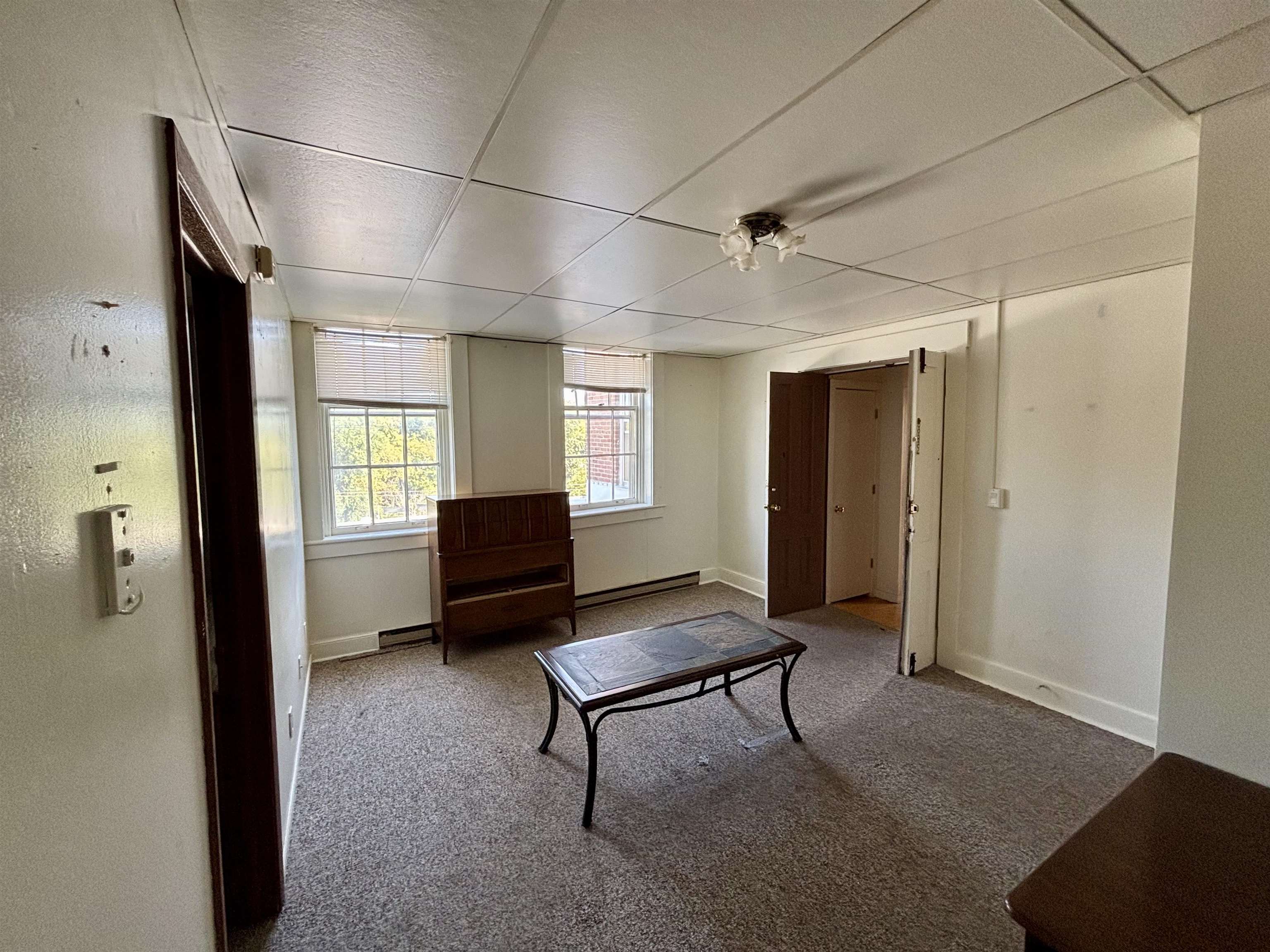 101 West Market Street Mount Carroll, IL 61053 - Photo 21 of 26 a living room with furniture and a window