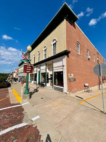 a front view of a building with an outdoor space