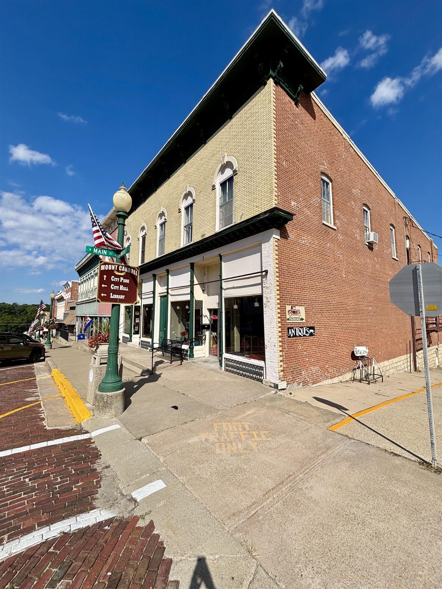 101 West Market Street Mount Carroll, IL 61053 - Photo 23 of 26 a front view of a building with an outdoor space