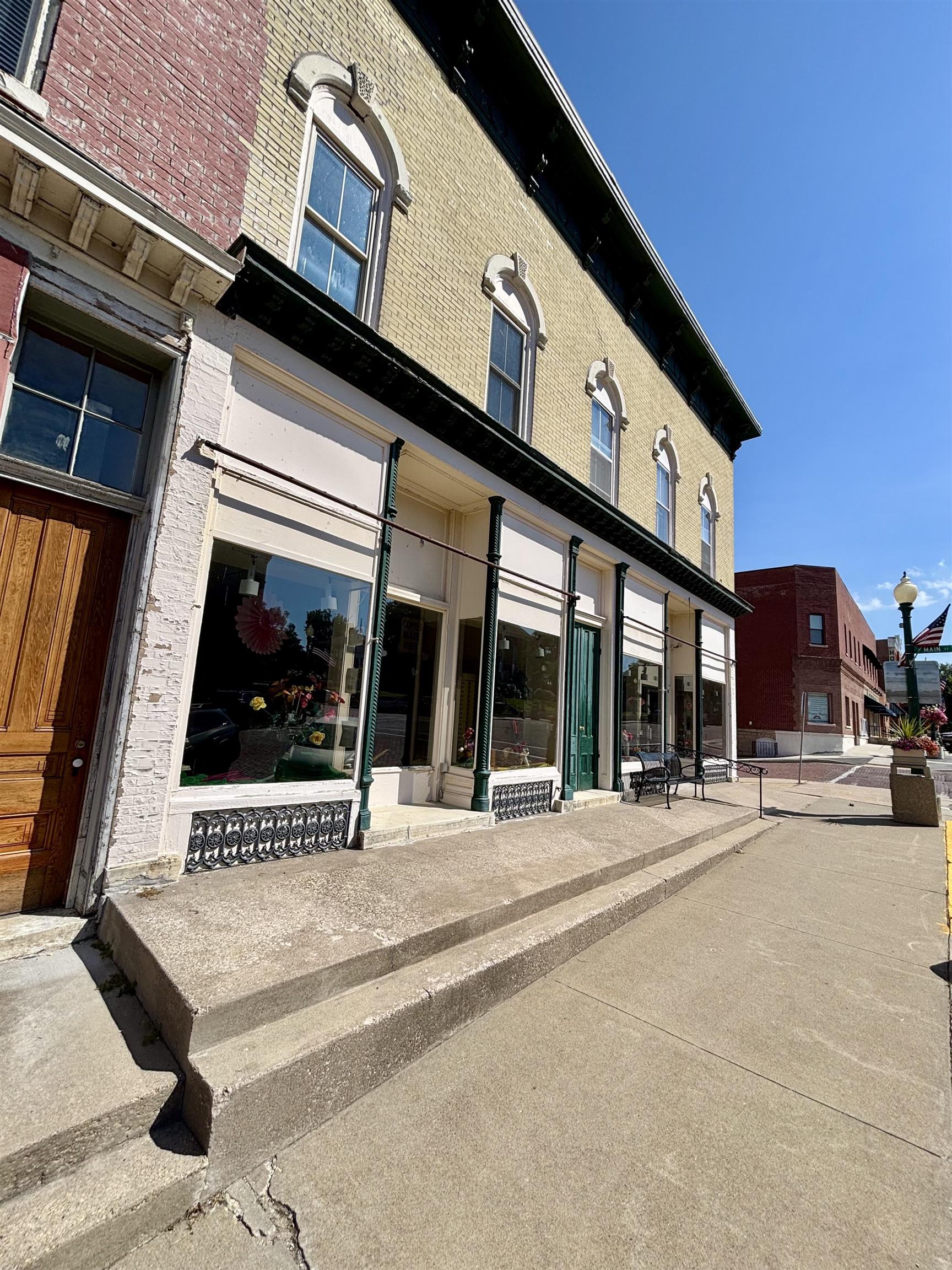 101 West Market Street Mount Carroll, IL 61053 - Photo 3 of 26 a view of a building with car parked