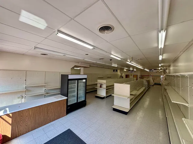 a view of an empty room with washing machine