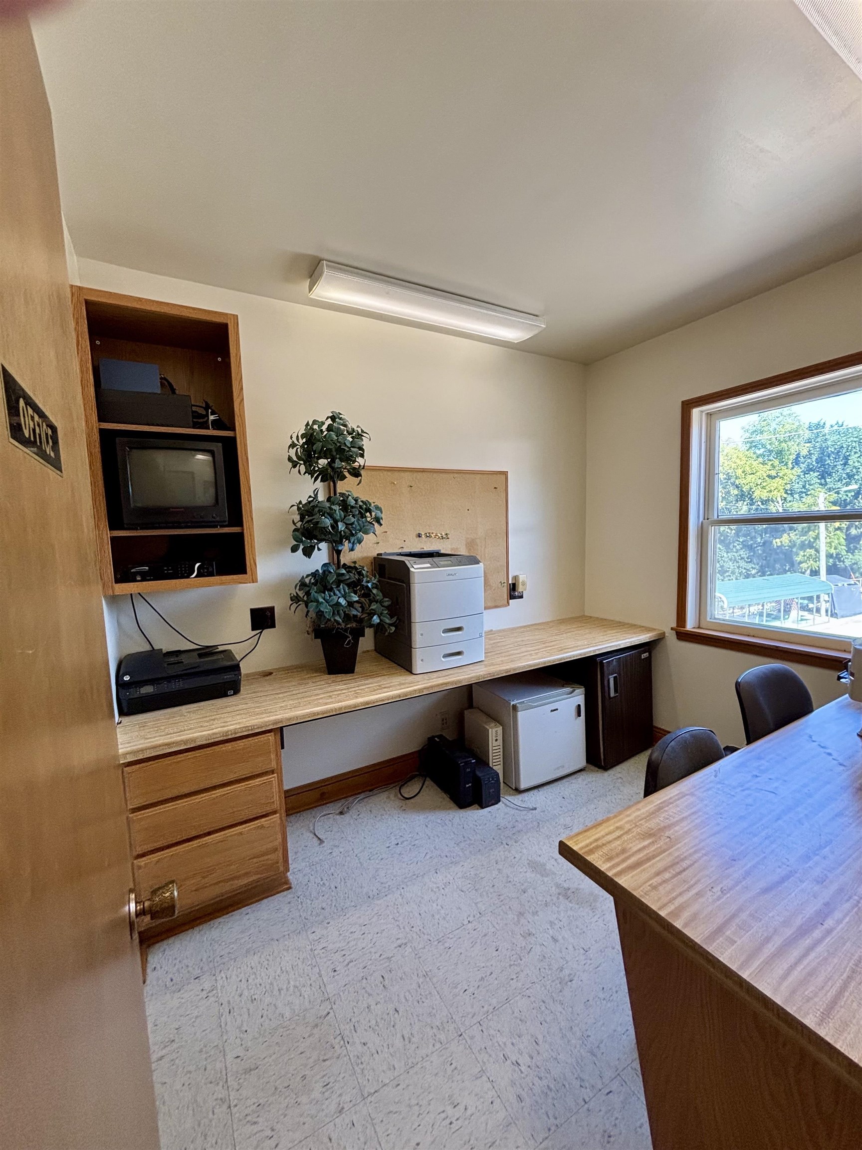 101 West Market Street Mount Carroll, IL 61053 - Photo 10 of 26 a living room with stainless steel appliances kitchen island granite countertop furniture and a large window