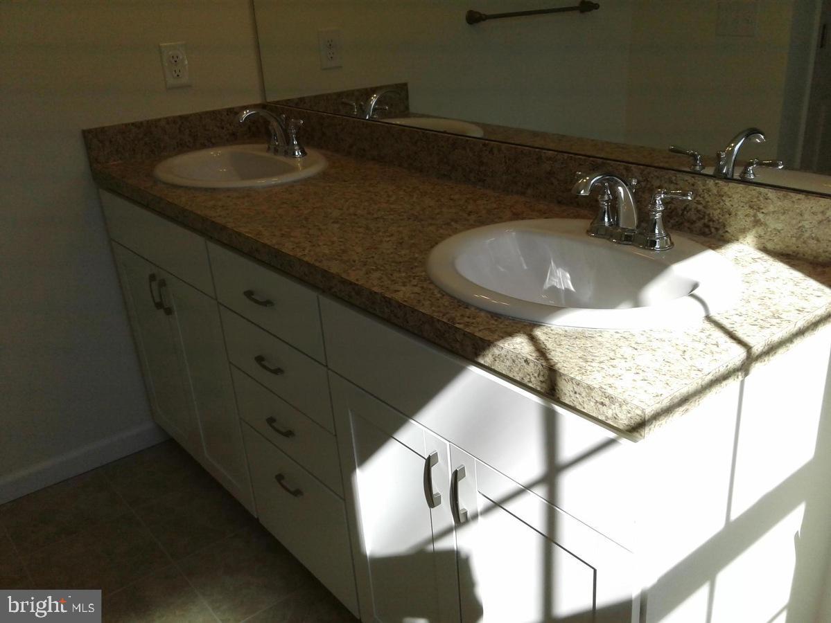 131 Cooper Folly Road Atco, NJ 08004 - Photo 14 of 26 a bathroom with a granite countertop sink and a mirror
