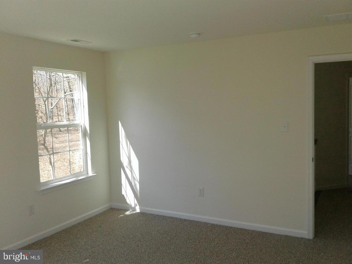 131 Cooper Folly Road Atco, NJ 08004 - Photo 15 of 26 an empty room with a window