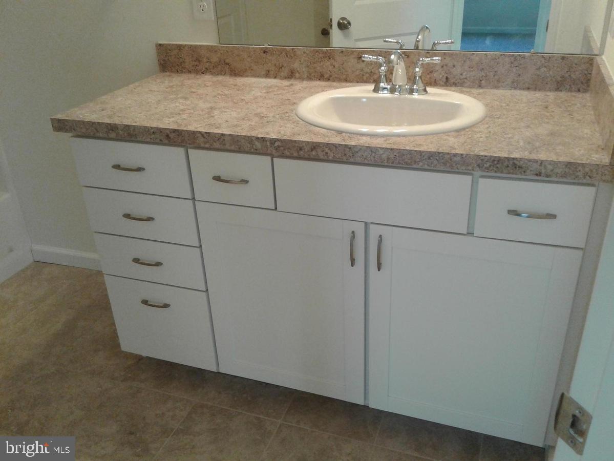 131 Cooper Folly Road Atco, NJ 08004 - Photo 16 of 26 a bathroom with a granite countertop sink and vanity