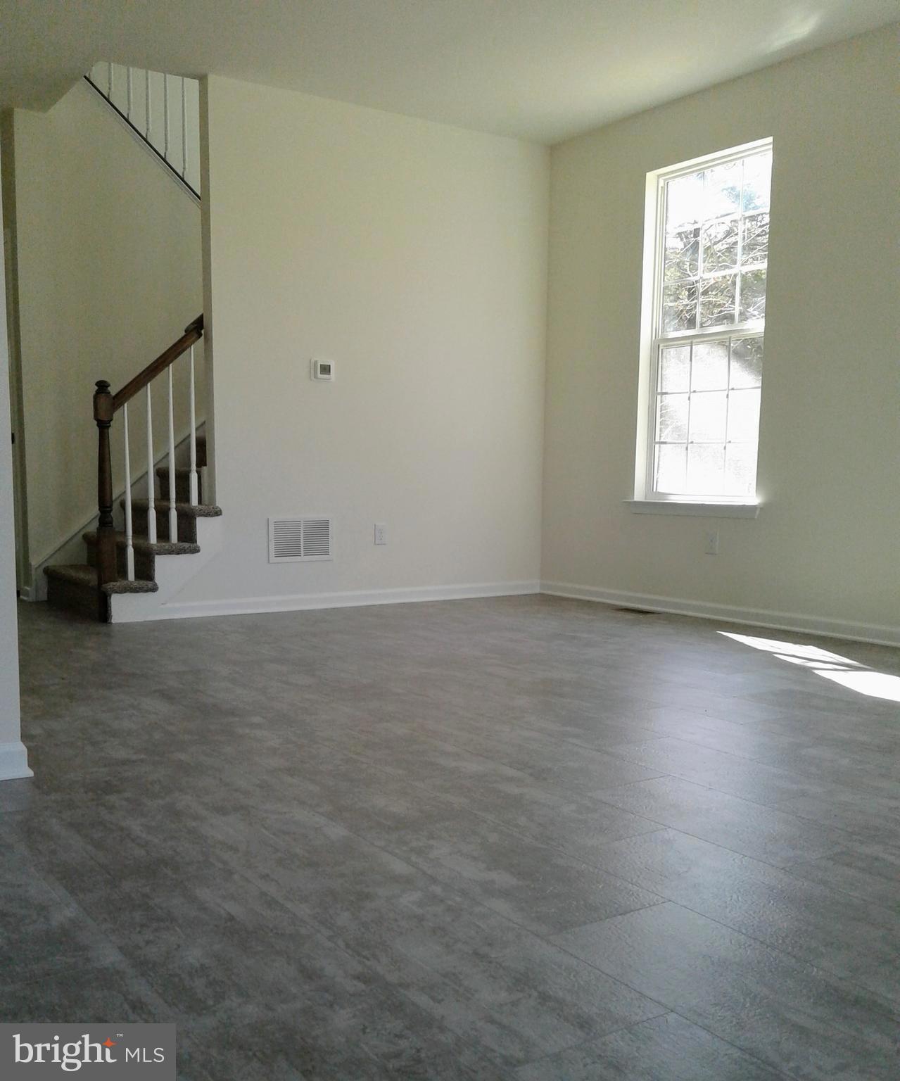 131 Cooper Folly Road Atco, NJ 08004 - Photo 6 of 26 en empty room with windows