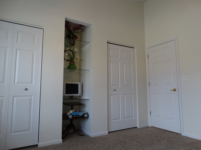 544 Birch Road Woodstock, IL 60098 - Photo 12 of 25 a view of a livingroom with wooden floor and closet