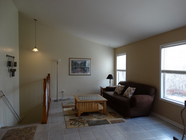 544 Birch Road Woodstock, IL 60098 - Photo 9 of 25 a living room with furniture and a window