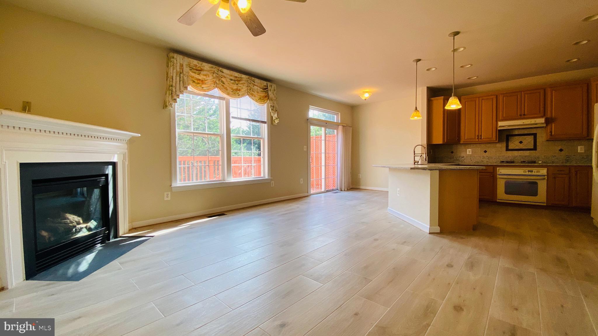 8853 Modano Place Fairfax, VA 22031 - Photo 12 of 32 Family room and kitchen