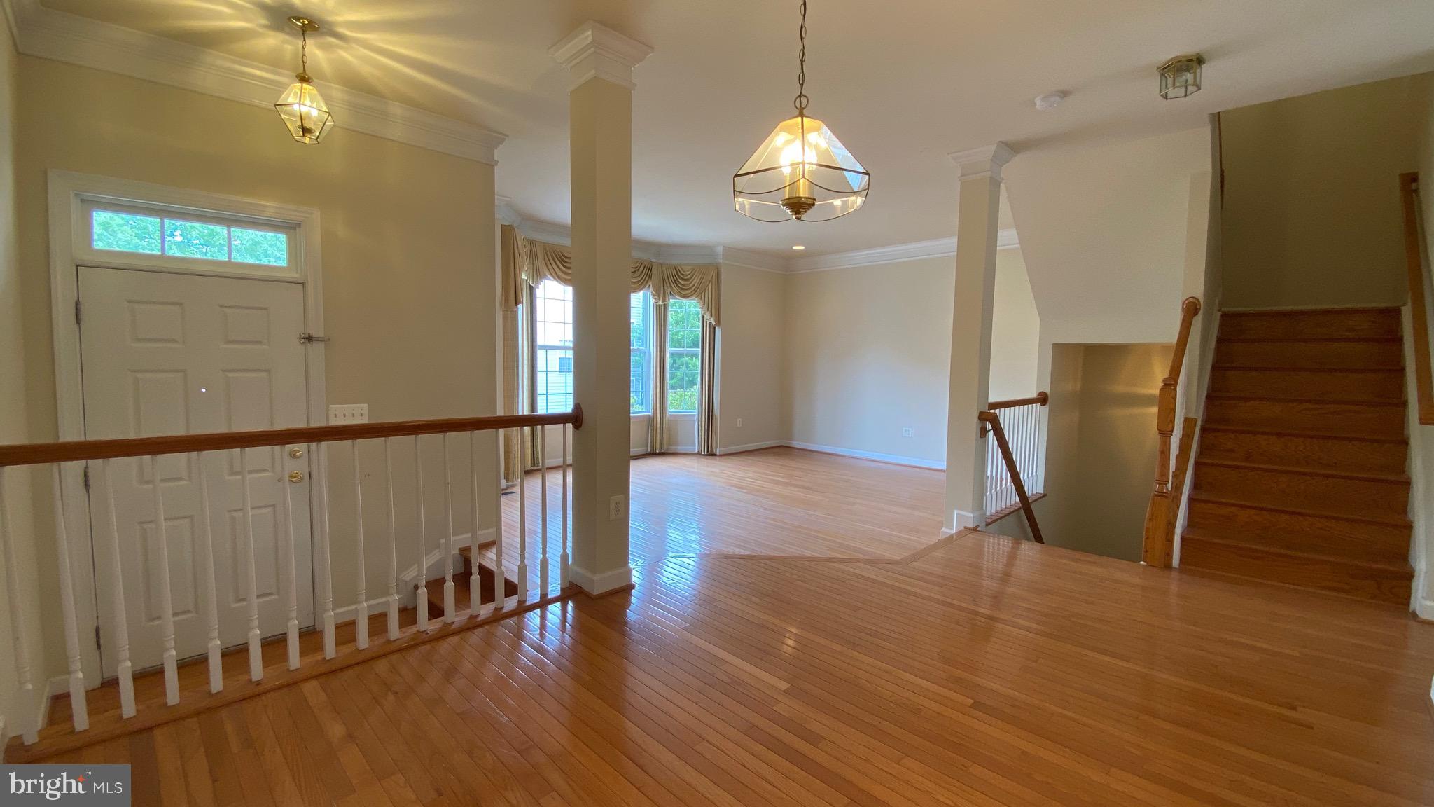 8853 Modano Place Fairfax, VA 22031 - Photo 7 of 32 Dining room adjacent to stairwells
