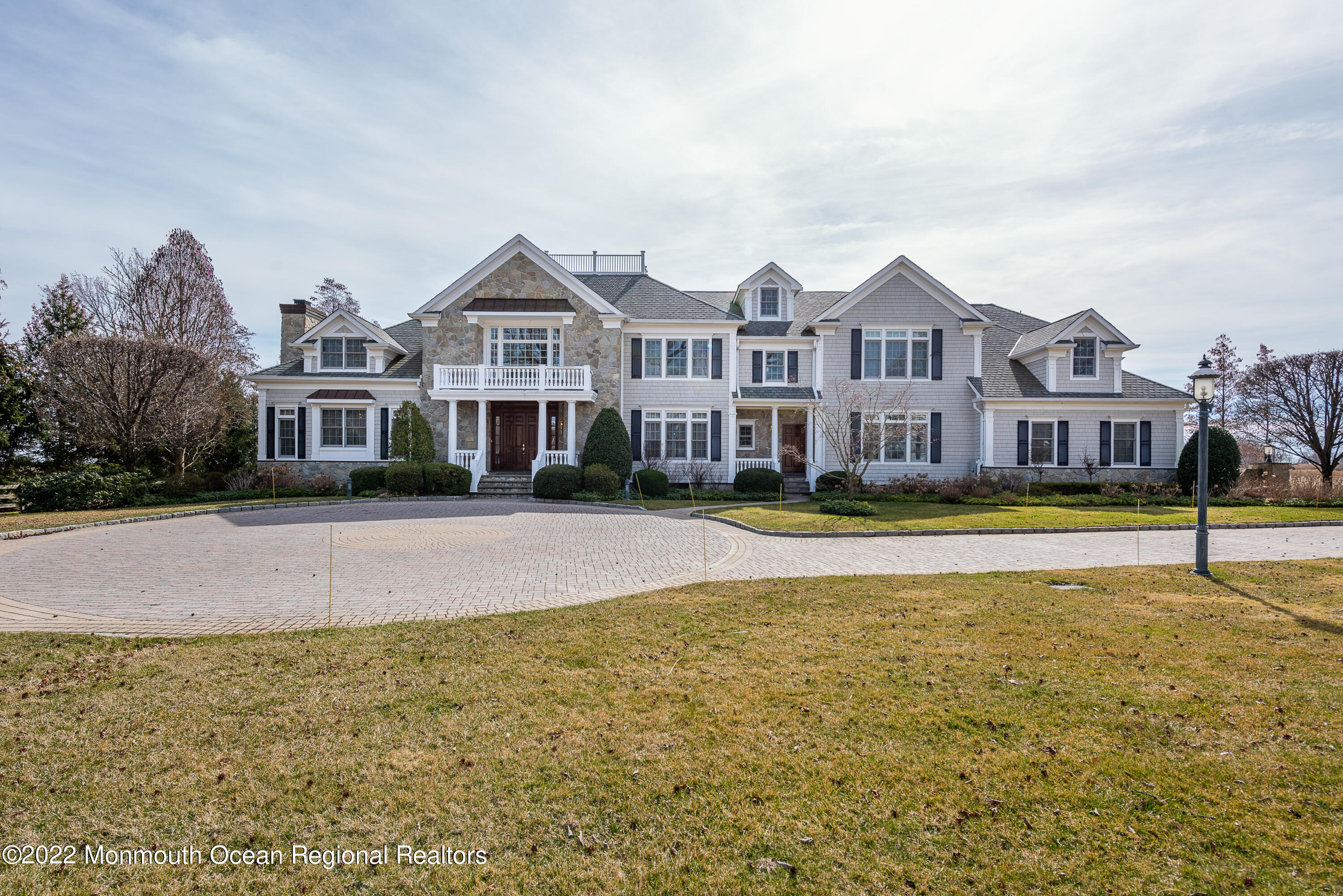 24 Conover Lane Rumson, NJ 07760 - Photo 1 of 39 a front view of a house with swimming pool