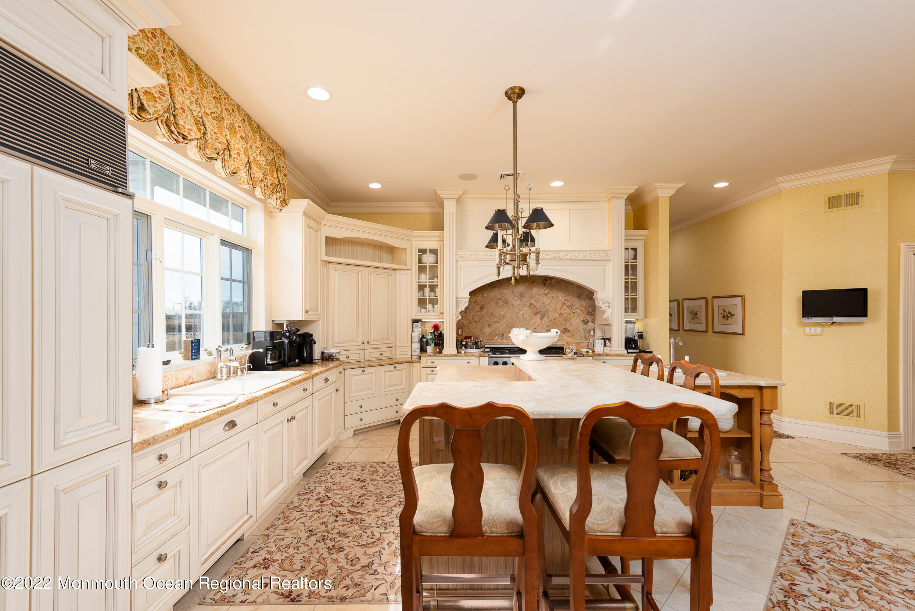 24 Conover Lane Rumson, NJ 07760 - Photo 14 of 39 a large kitchen with a table and chairs