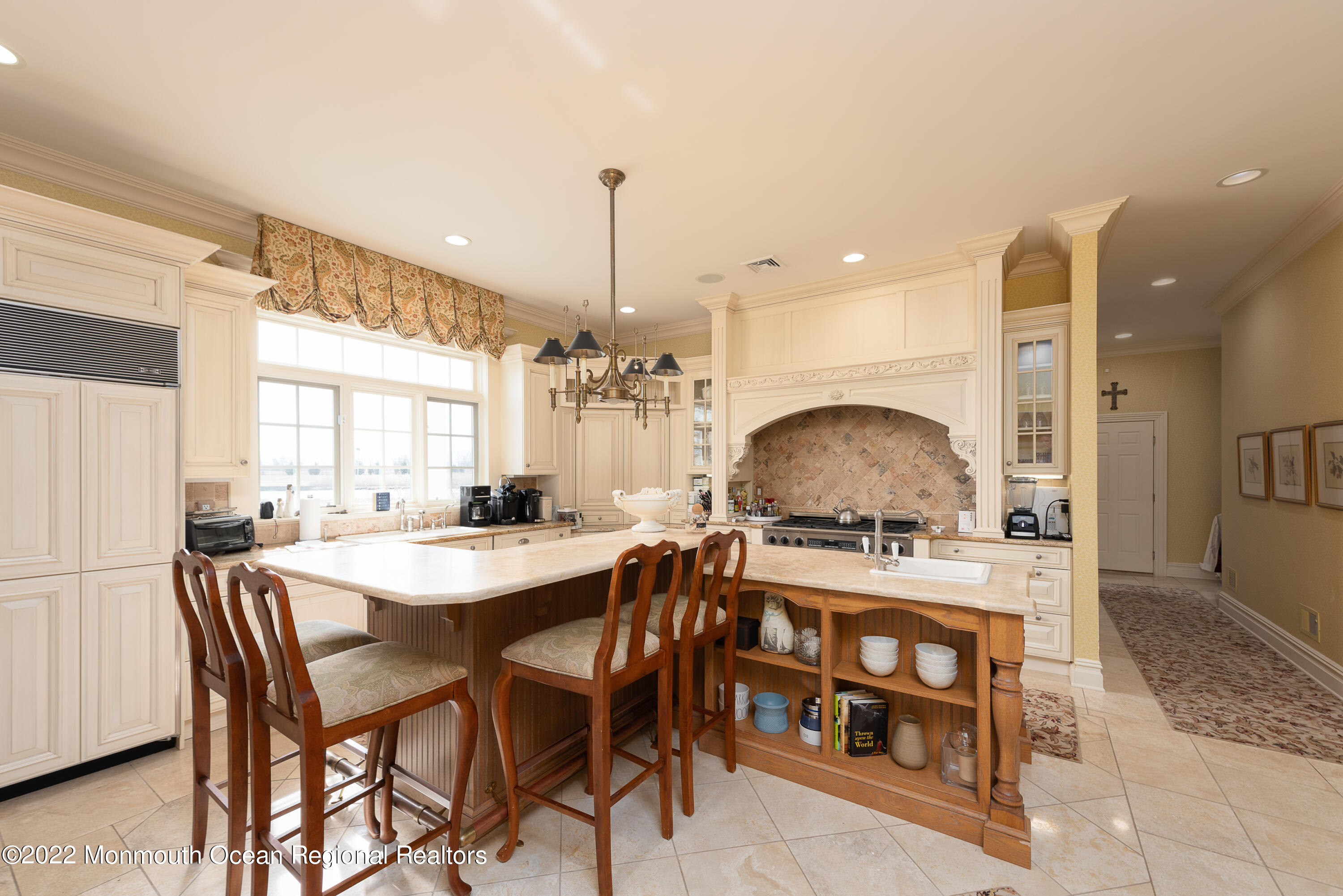 24 Conover Lane Rumson, NJ 07760 - Photo 15 of 39 a kitchen with a stove a table and chairs
