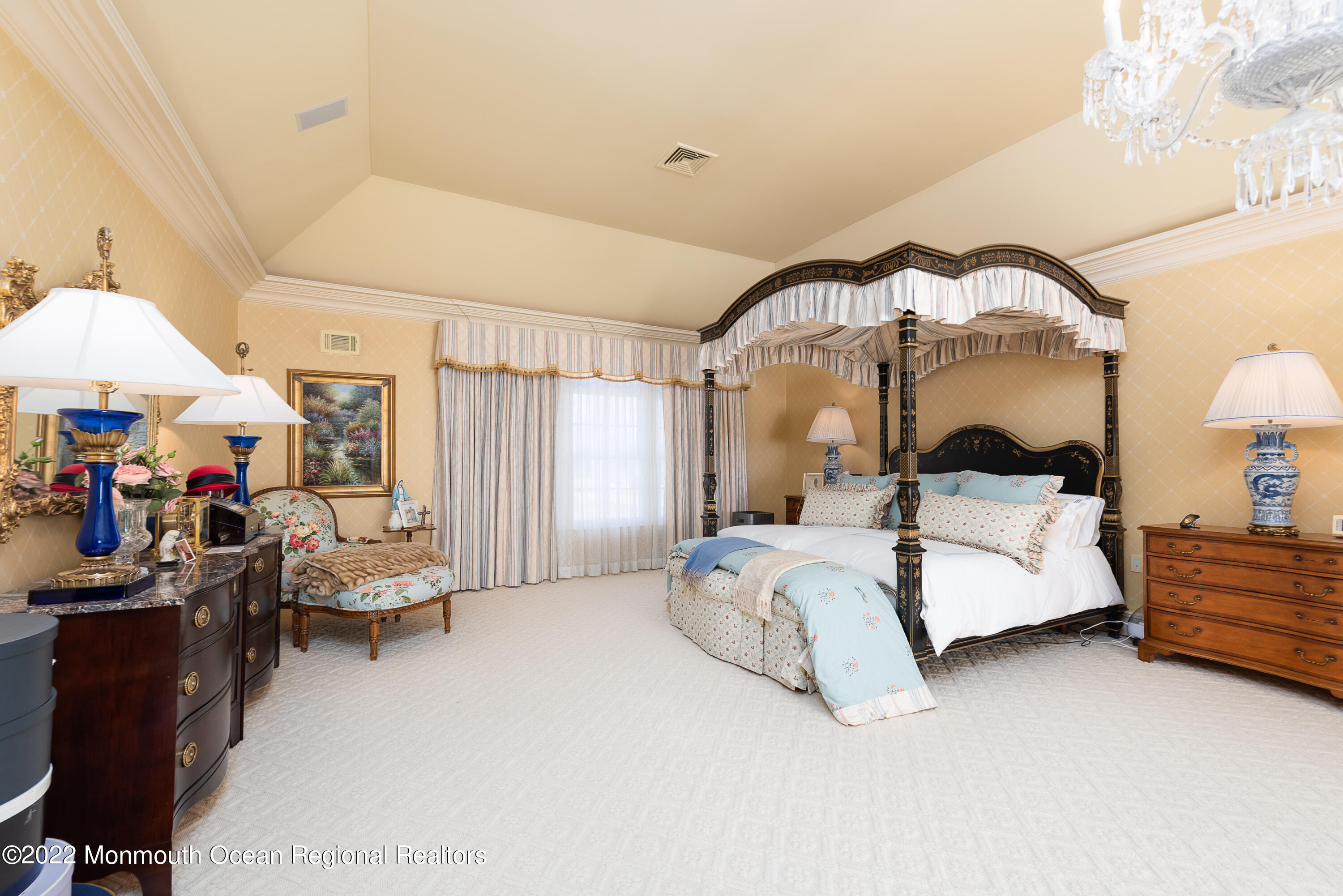 24 Conover Lane Rumson, NJ 07760 - Photo 20 of 39 a bedroom with bed and a chandelier