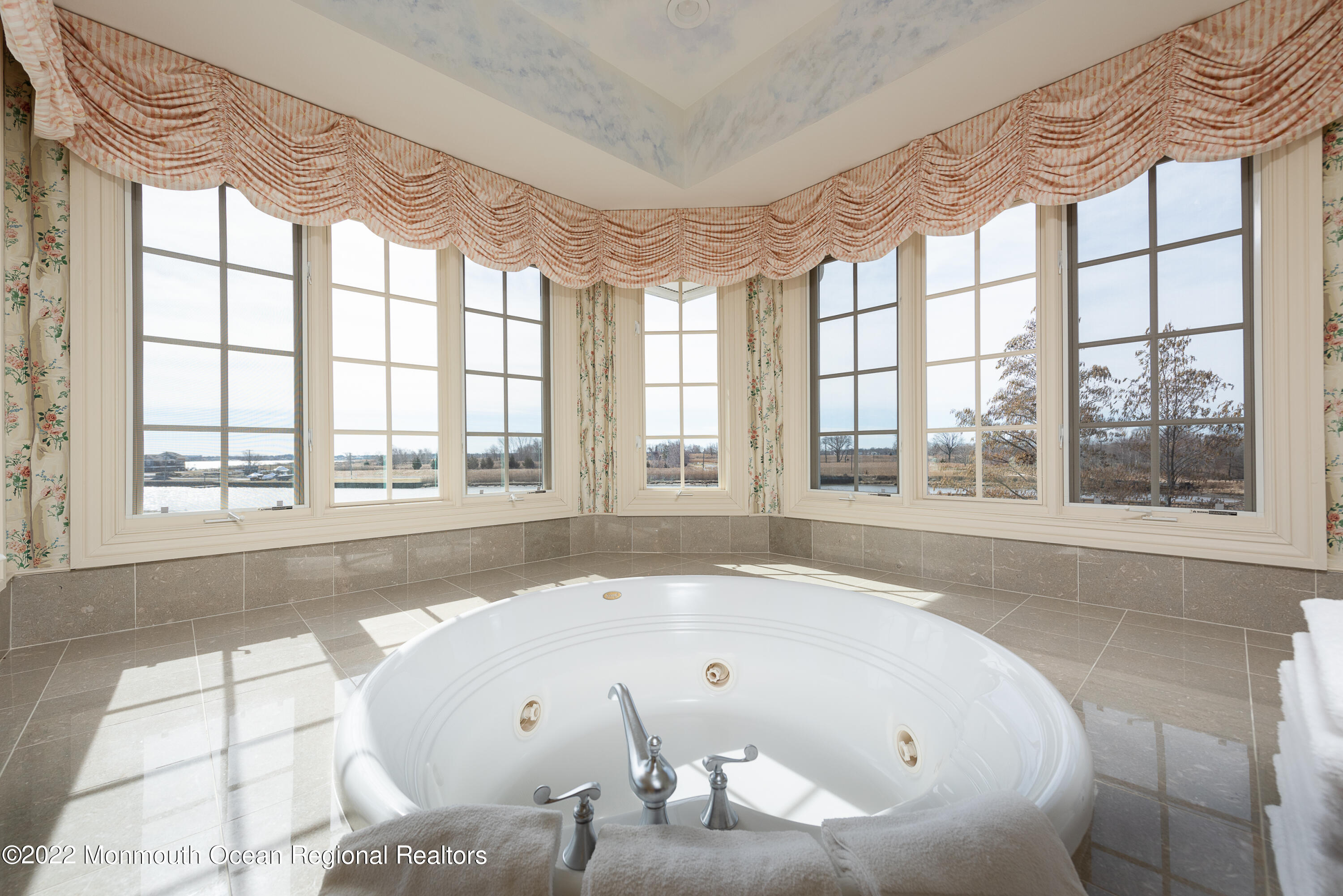 24 Conover Lane Rumson, NJ 07760 - Photo 24 of 39 a large tub sitting in a bathroom next to a window