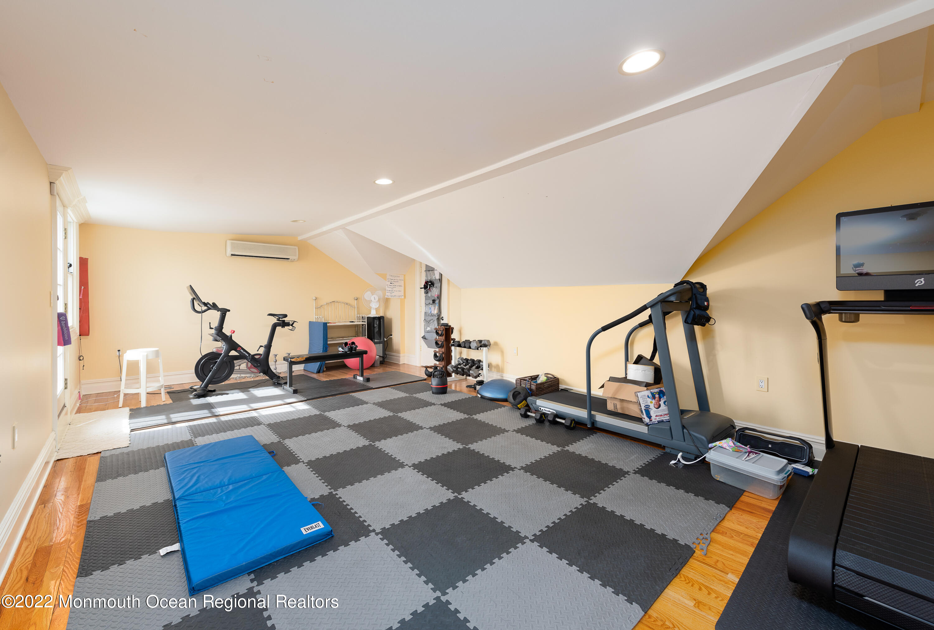 24 Conover Lane Rumson, NJ 07760 - Photo 29 of 39 a room with gym equipment and a mirror