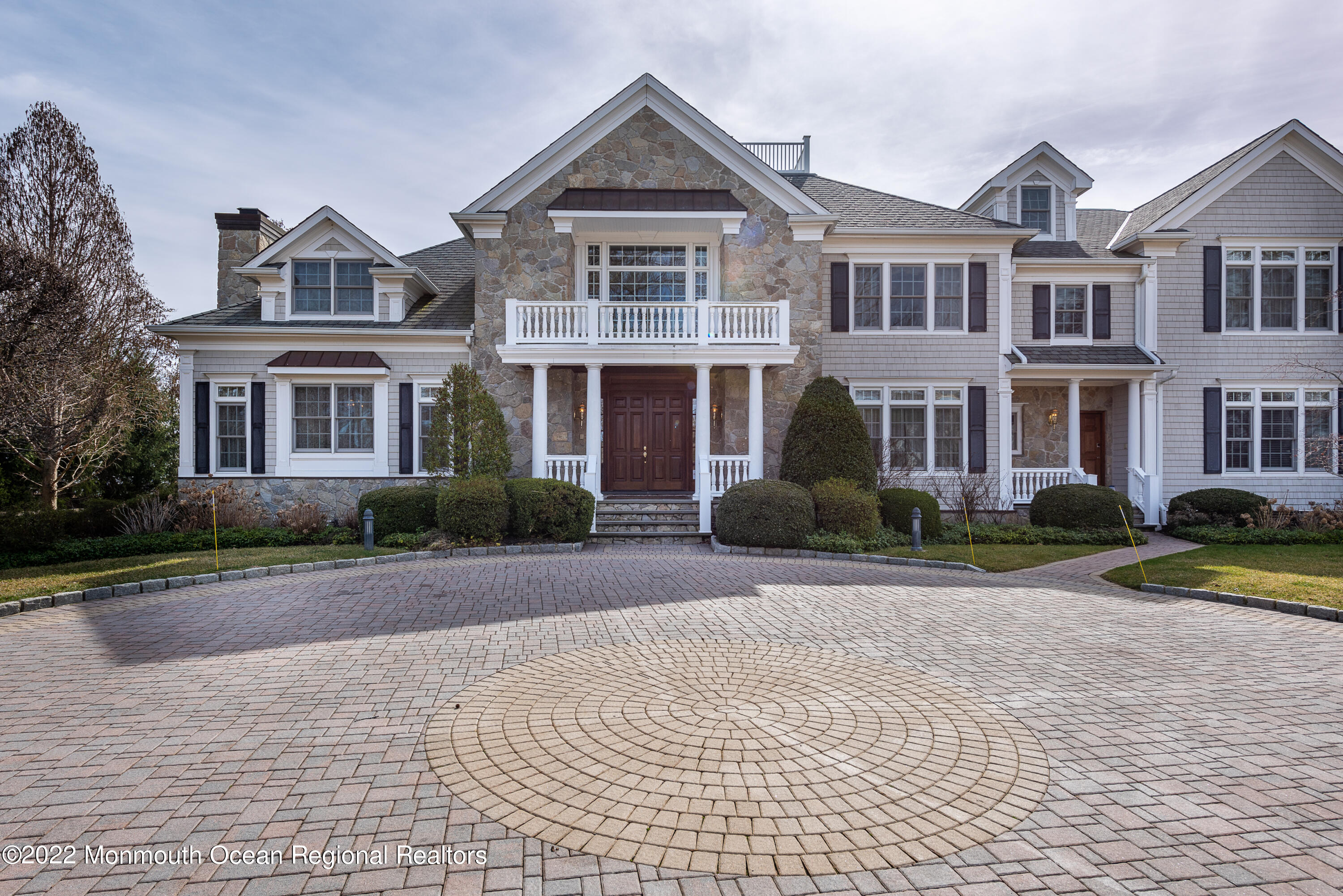 24 Conover Lane Rumson, NJ 07760 - Photo 3 of 39 a front view of a house with yard and green space