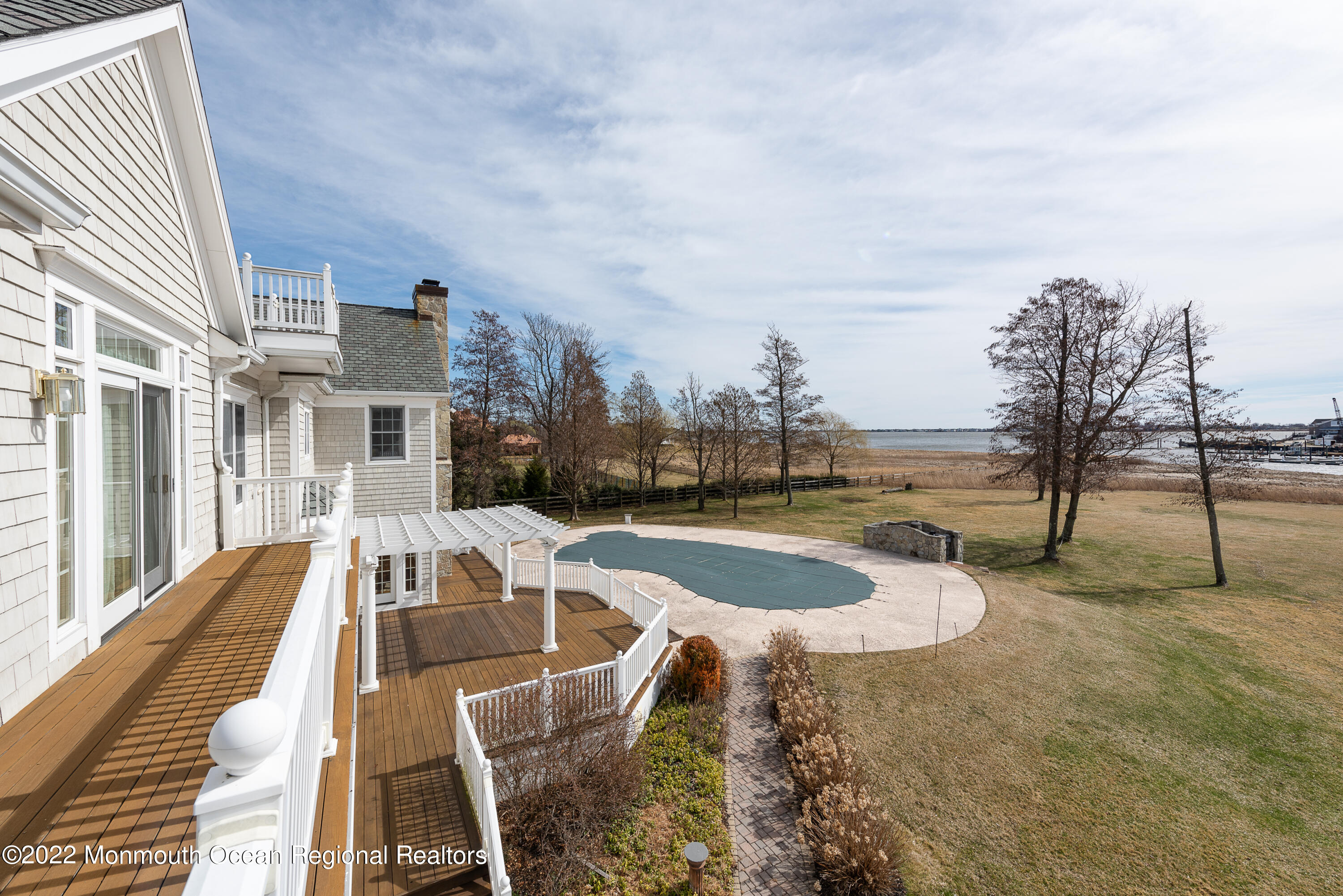 24 Conover Lane Rumson, NJ 07760 - Photo 32 of 39 a view of a swimming pool with a lounge chairs
