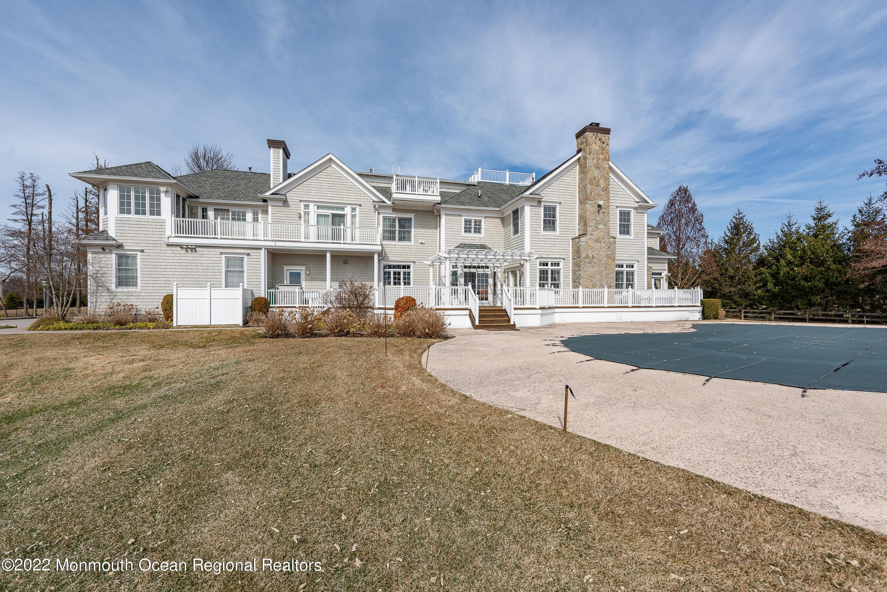 24 Conover Lane Rumson, NJ 07760 - Photo 35 of 39 a view of a white house with a yard