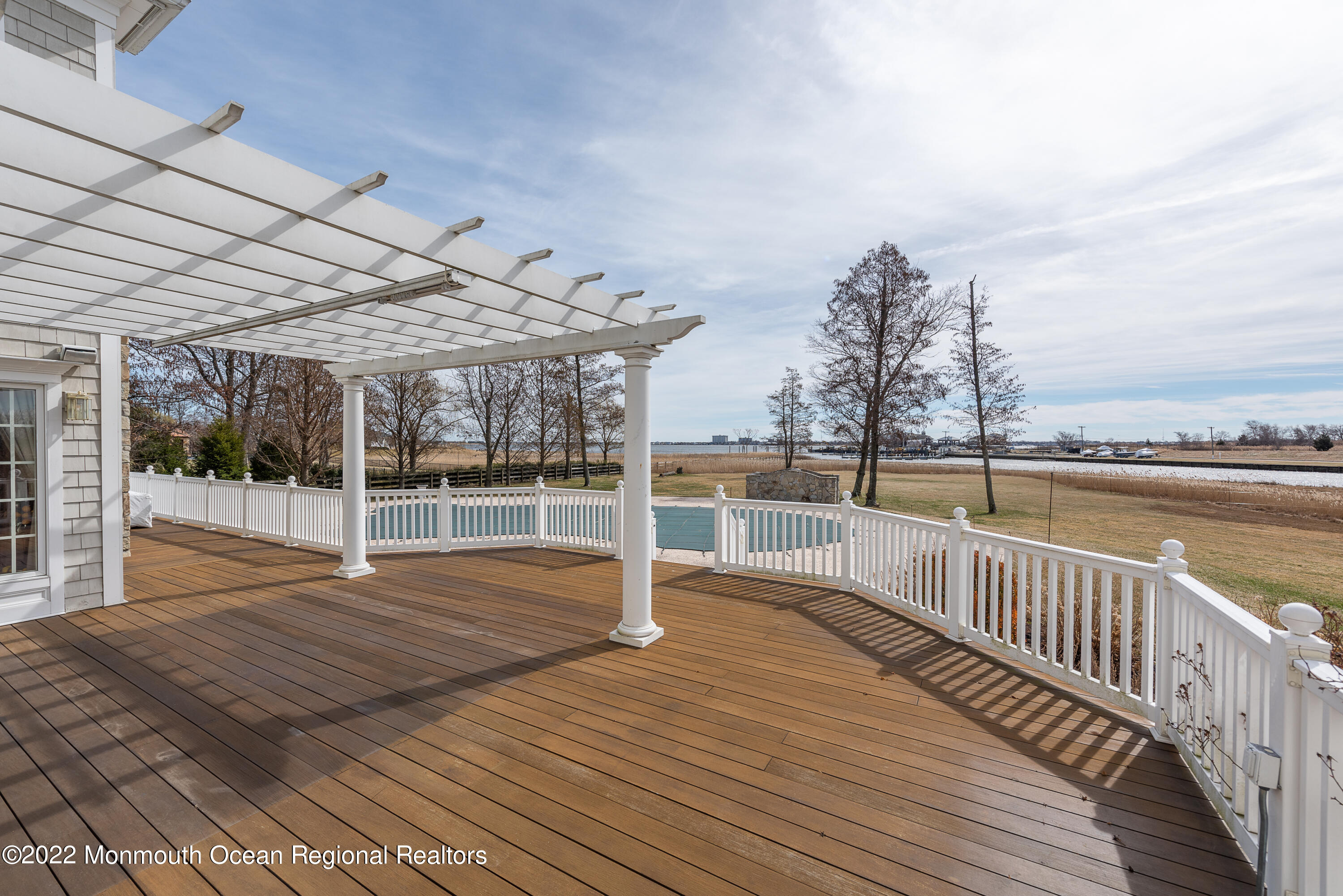 24 Conover Lane Rumson, NJ 07760 - Photo 36 of 39 a view of a balcony with wooden floor and iron fence
