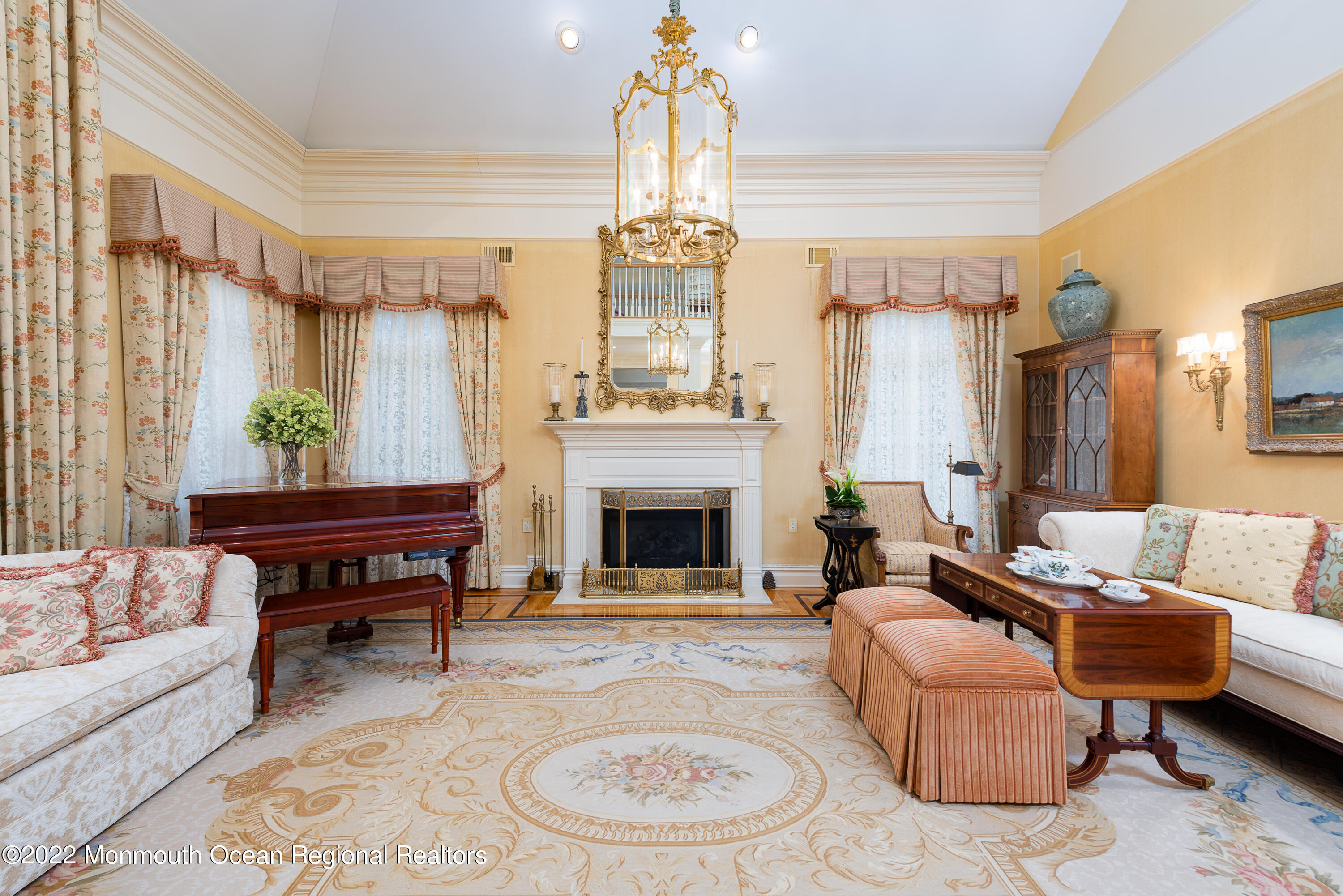 24 Conover Lane Rumson, NJ 07760 - Photo 6 of 39 a living room with furniture a fireplace and a chandelier
