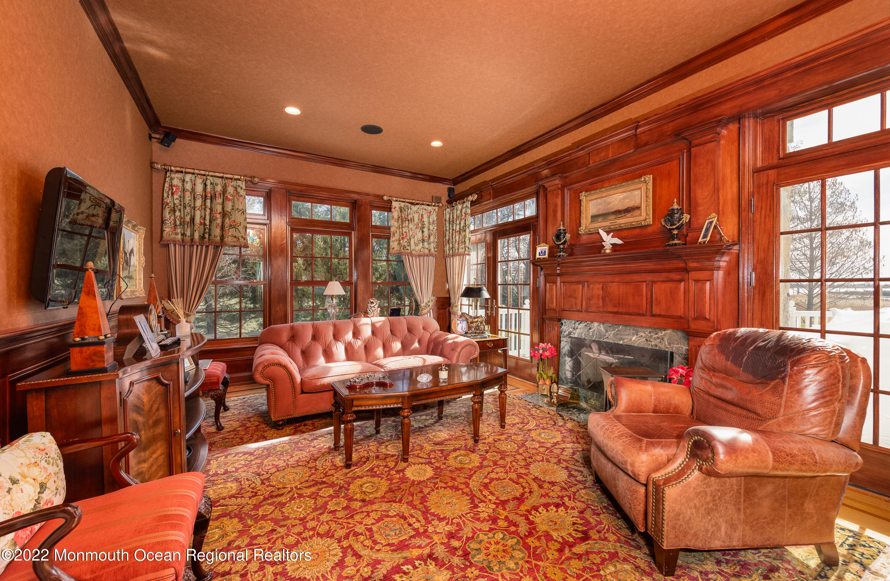 24 Conover Lane Rumson, NJ 07760 - Photo 8 of 39 a living room with furniture a large window and a flat screen tv