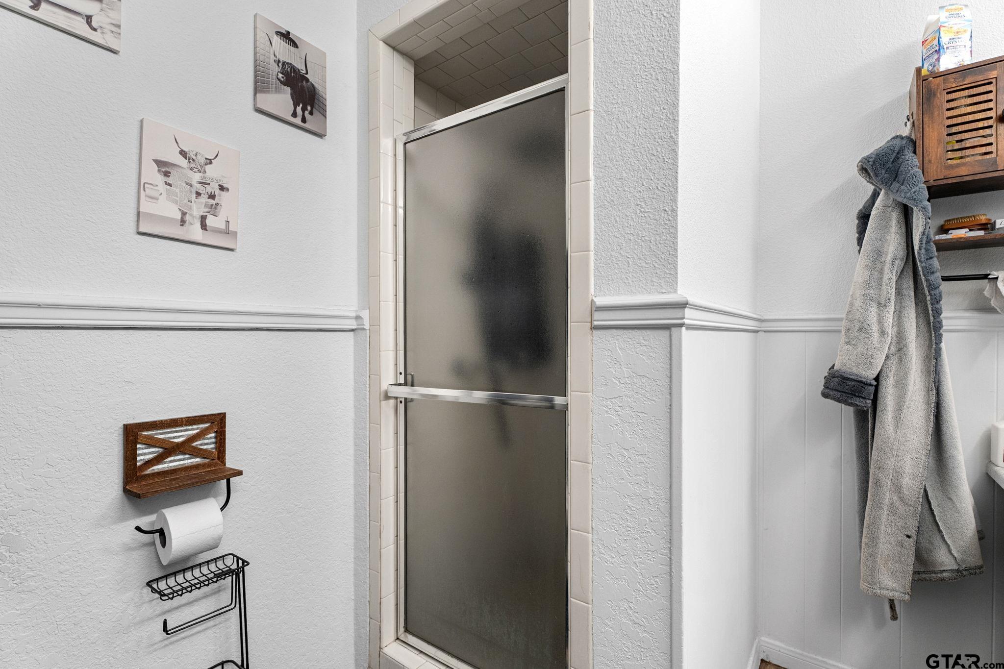7649 Timber Circle Tyler, TX 75708 - Photo 13 of 25 a view of walk in closet with clothes and shoes