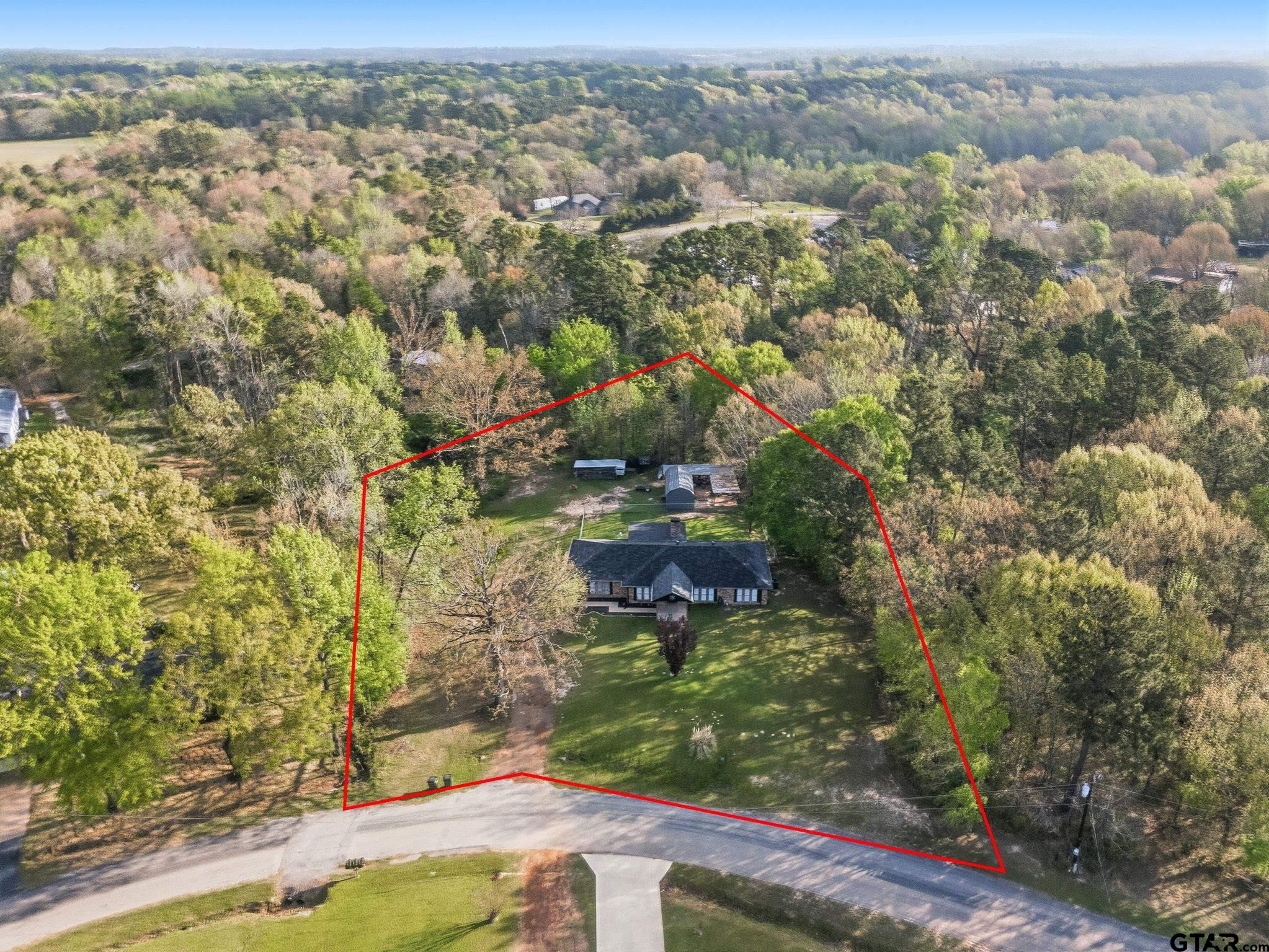 7649 Timber Circle Tyler, TX 75708 - Photo 2 of 25 an aerial view of residential houses with outdoor space