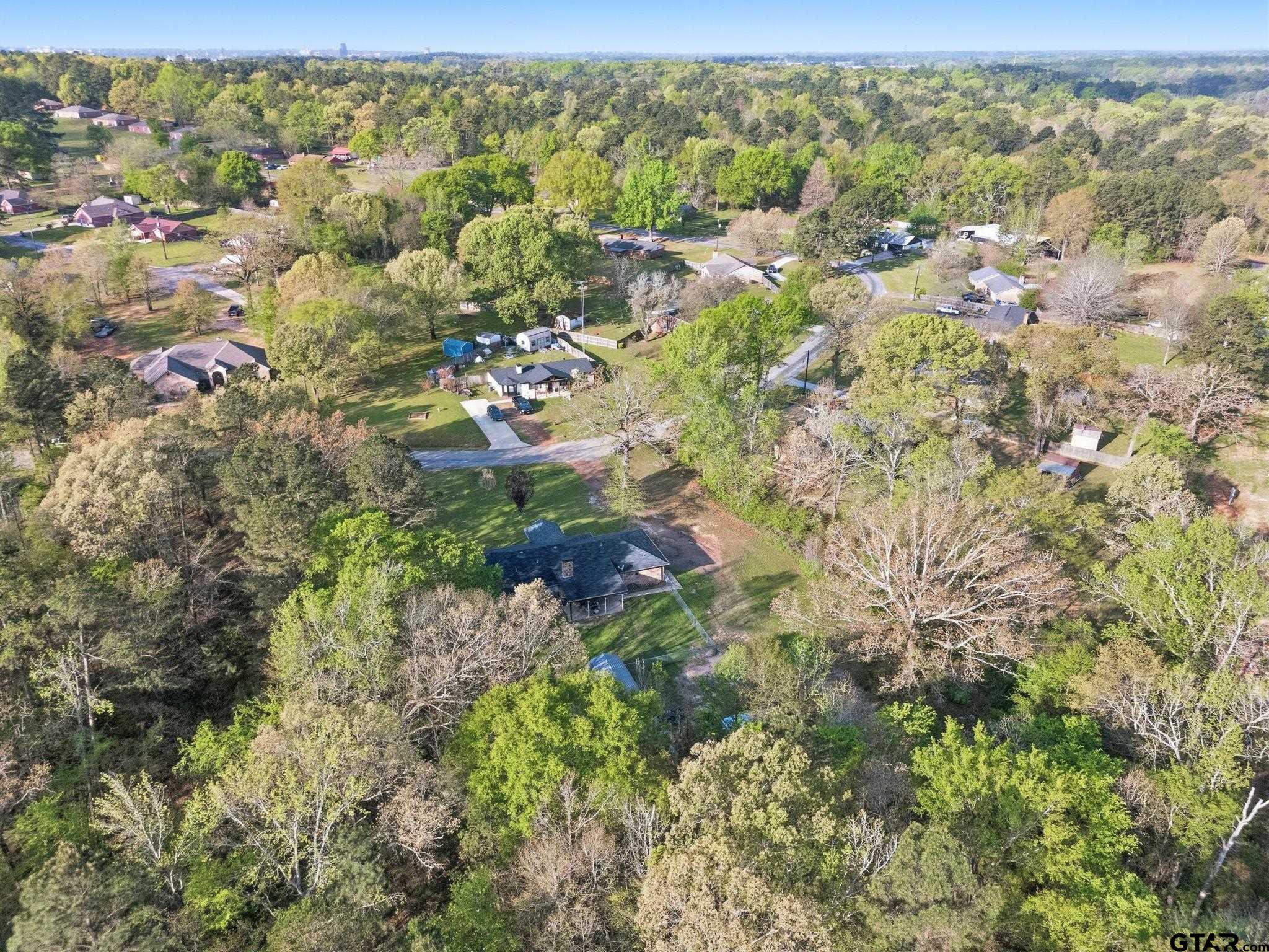 7649 Timber Circle Tyler, TX 75708 - Photo 25 of 25 a view of a forest with a street