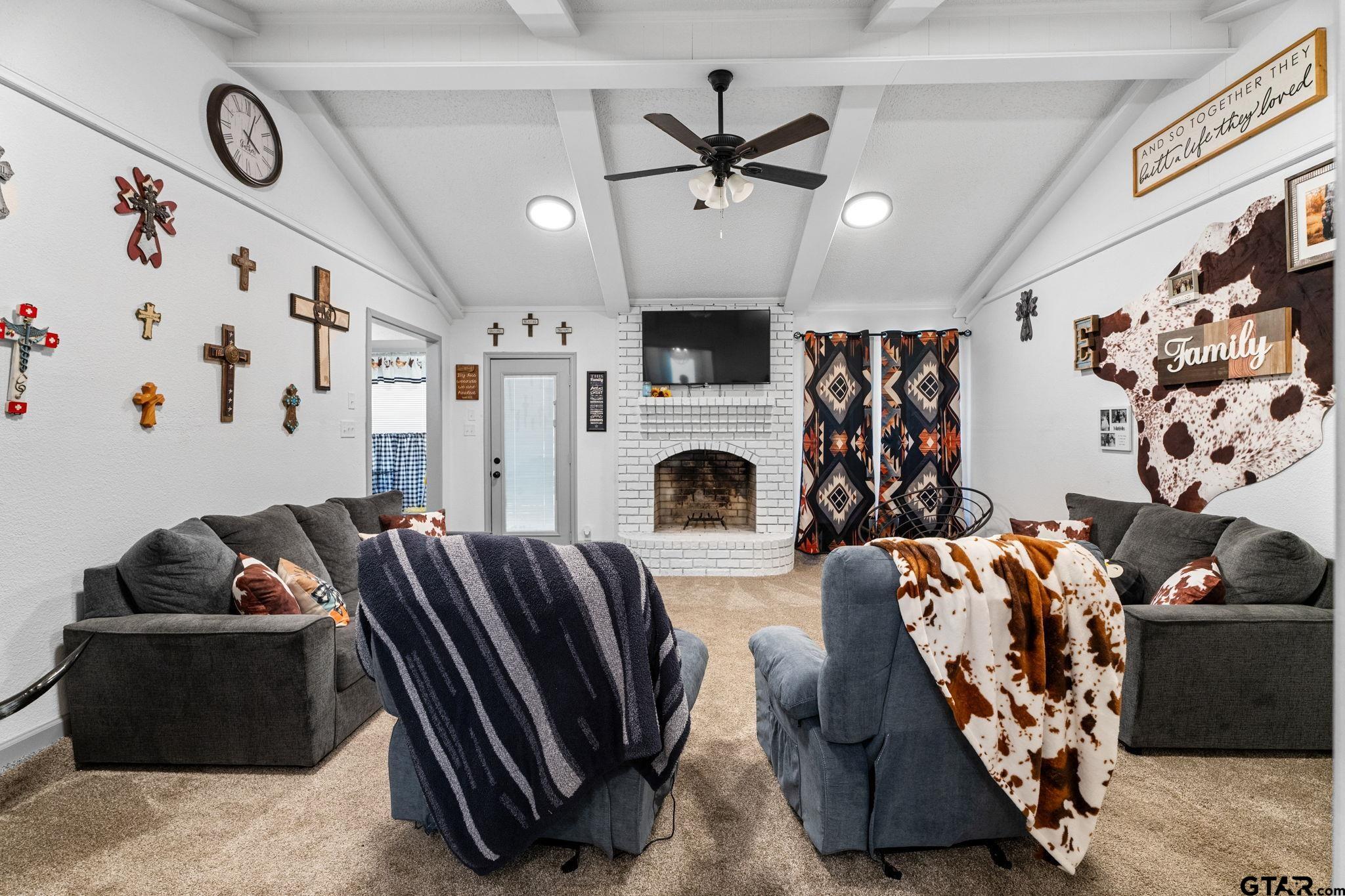 7649 Timber Circle Tyler, TX 75708 - Photo 4 of 25 a living room with furniture fireplace and flat screen tv