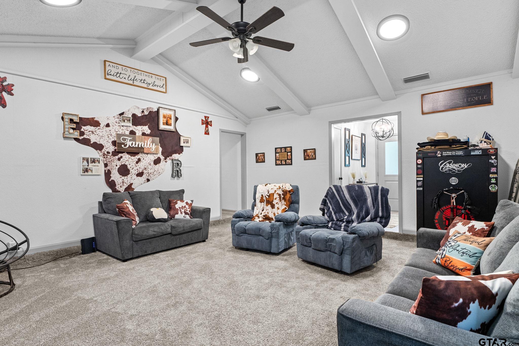 7649 Timber Circle Tyler, TX 75708 - Photo 6 of 25 a living room with furniture and a flat screen tv