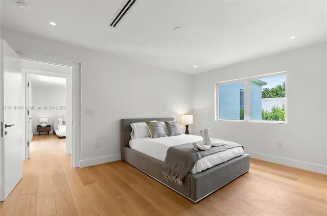 a bedroom with a bed and a table