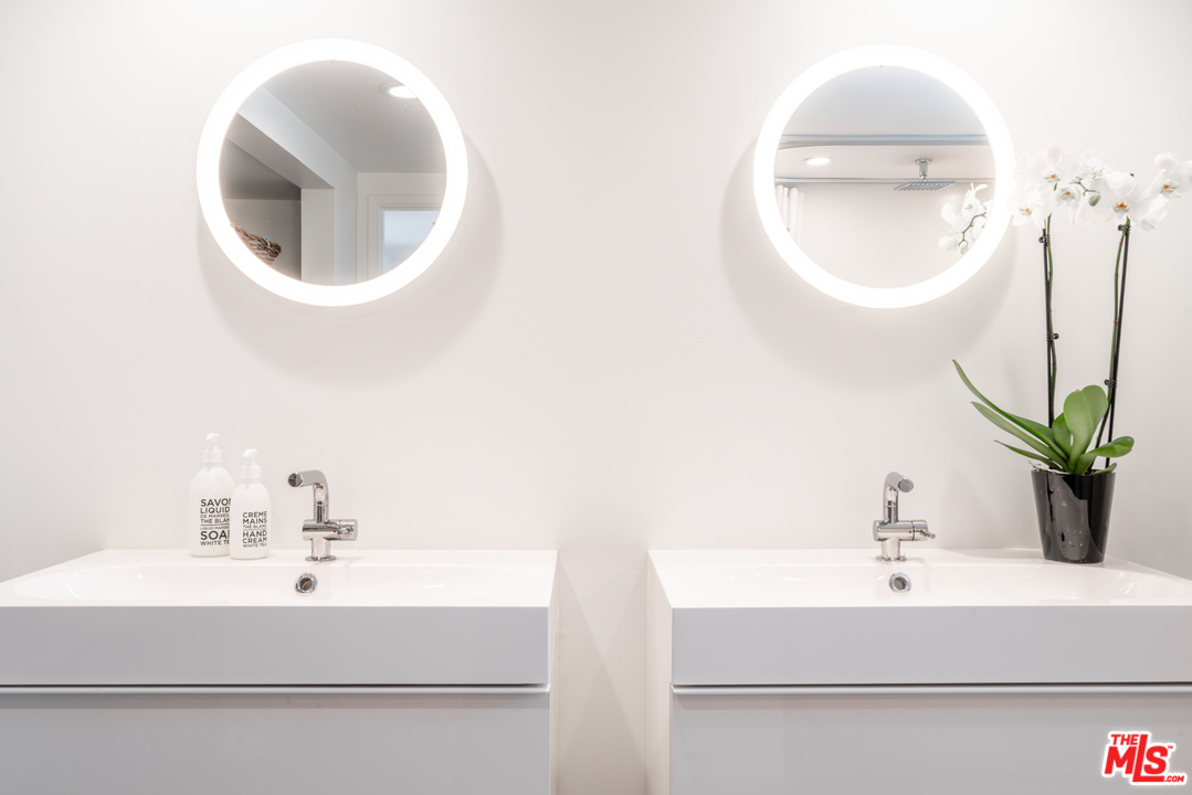 31034 Broad Beach Road Malibu, CA 90265 - Photo 12 of 21 a bathroom with a sink and a mirror