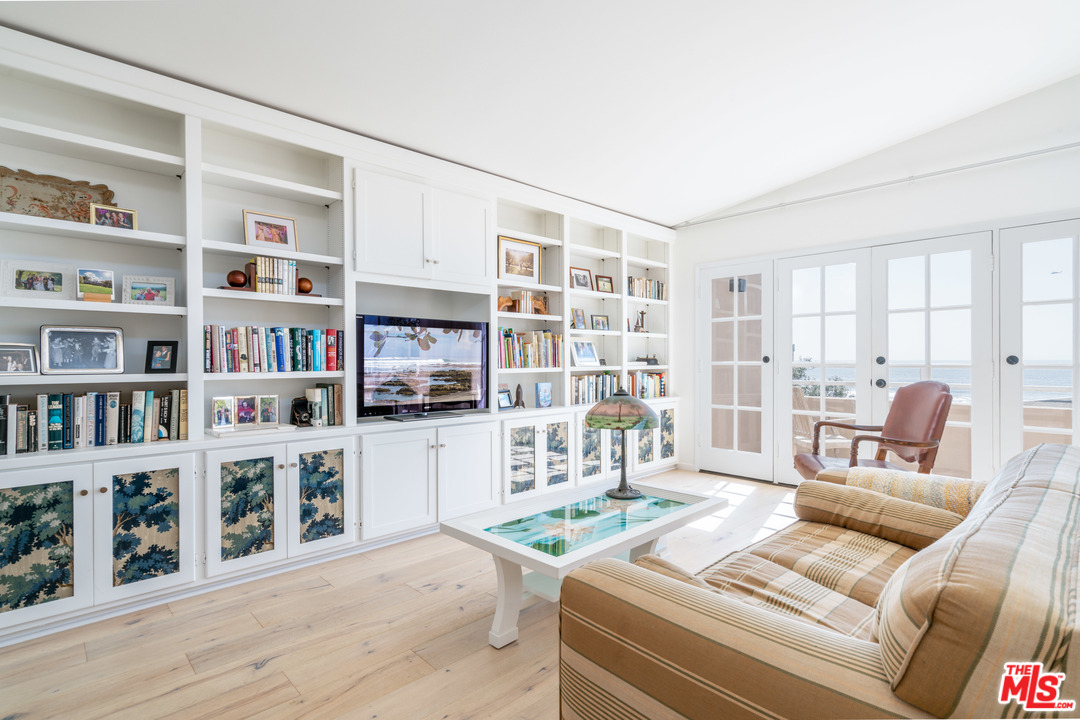 31034 Broad Beach Road Malibu, CA 90265 - Photo 13 of 21 a living room with furniture and a book shelf