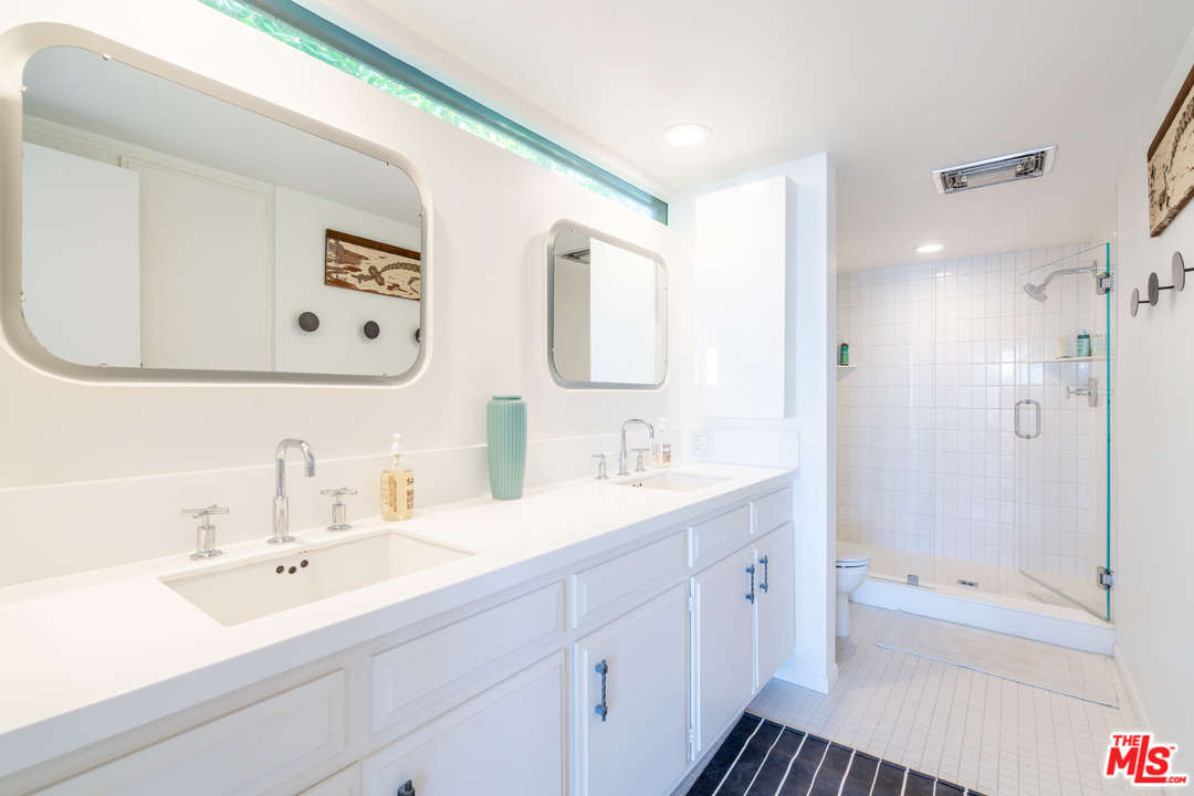 31034 Broad Beach Road Malibu, CA 90265 - Photo 15 of 21 a bathroom with a double vanity sink mirror and bathtub