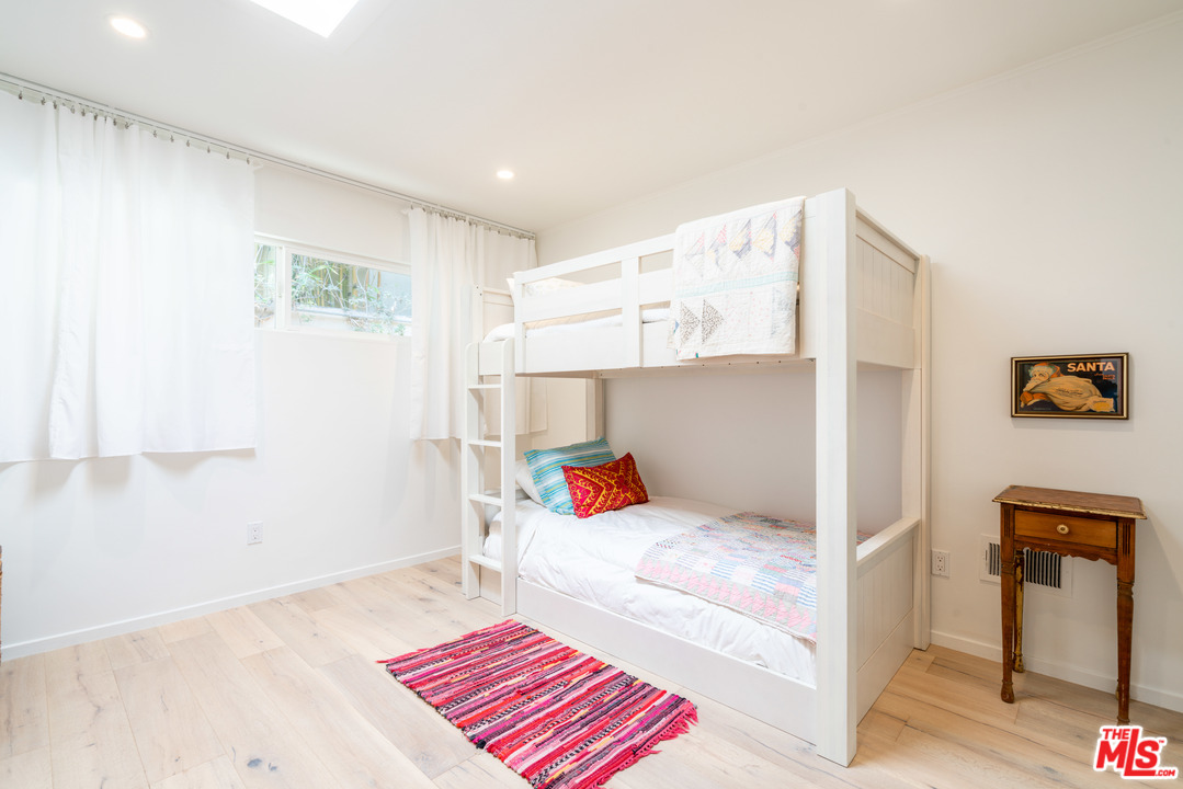 31034 Broad Beach Road Malibu, CA 90265 - Photo 16 of 21 a bedroom with a bed and a couch