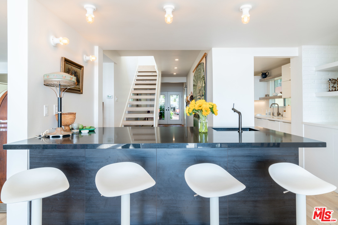31034 Broad Beach Road Malibu, CA 90265 - Photo 3 of 21 a dining room with furniture and wooden floor