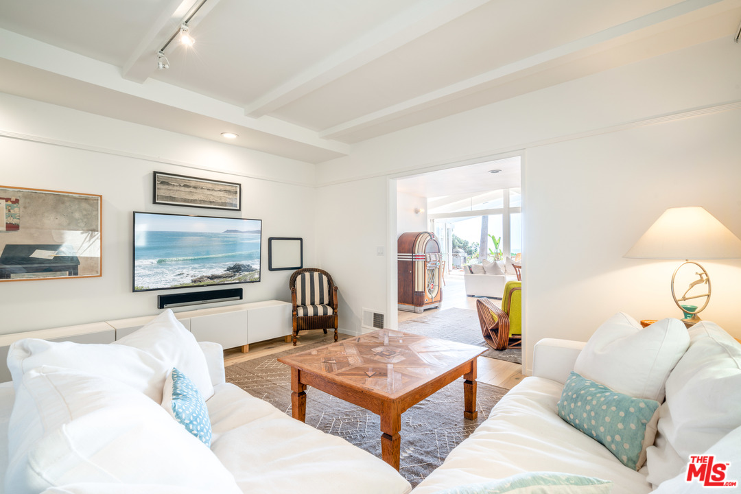 31034 Broad Beach Road Malibu, CA 90265 - Photo 9 of 21 a living room with furniture and a lamp