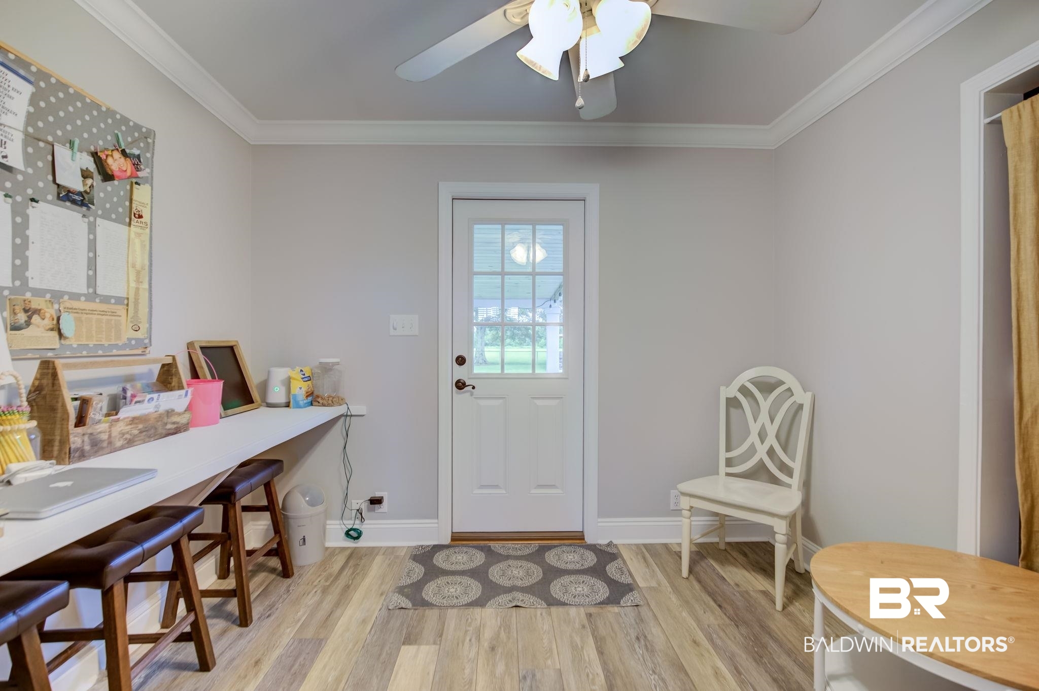 18732 Fairground Road Robertsdale, AL 36567 - Photo 19 of 46 Interior space with ceiling fan, light wood-type flooring, and crown molding