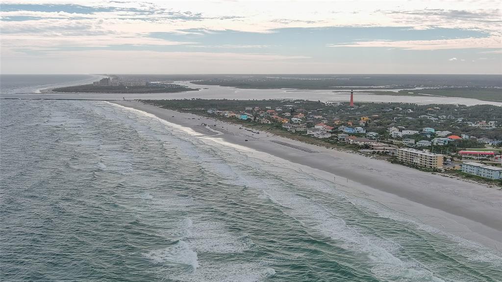 4740 South Atlantic Avenue, Unit 4 Ponce Inlet, FL 32127 - Photo 35 of 38 a view of an ocean and beach