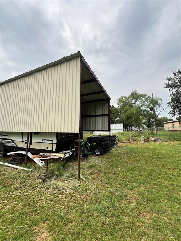 3400 Surfside Drive May, TX 76857 - Photo 13 of 39 a backyard of a house with table and chairs