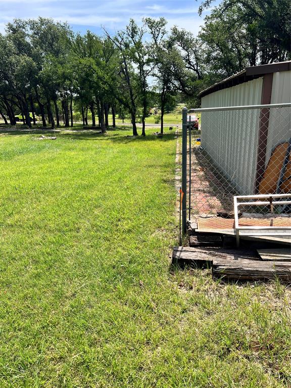 3400 Surfside Drive May, TX 76857 - Photo 14 of 39 a view of a backyard with wooden fence