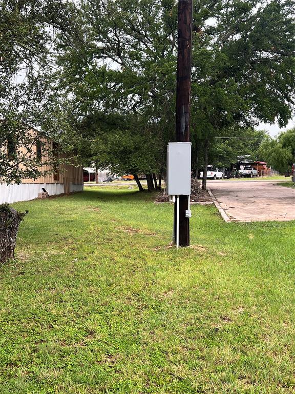 3400 Surfside Drive May, TX 76857 - Photo 18 of 39 a front view of a house with a yard and trees