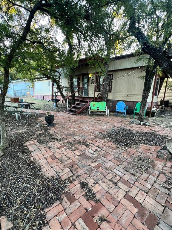 3400 Surfside Drive May, TX 76857 - Photo 2 of 39 a view of a house with backyard and sitting area