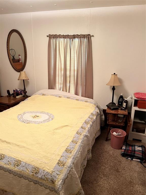 3400 Surfside Drive May, TX 76857 - Photo 32 of 39 a bed sitting in a bedroom next to a window